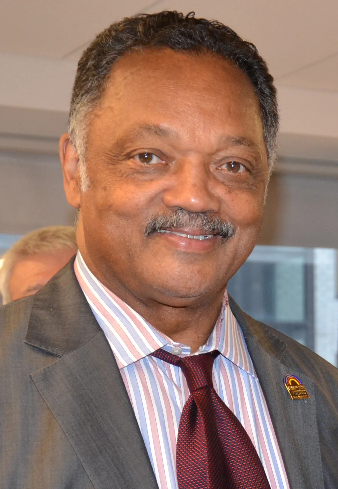 Jesse Jackson smiles during a 2013 meeting with American Federation of Government Employees leaders