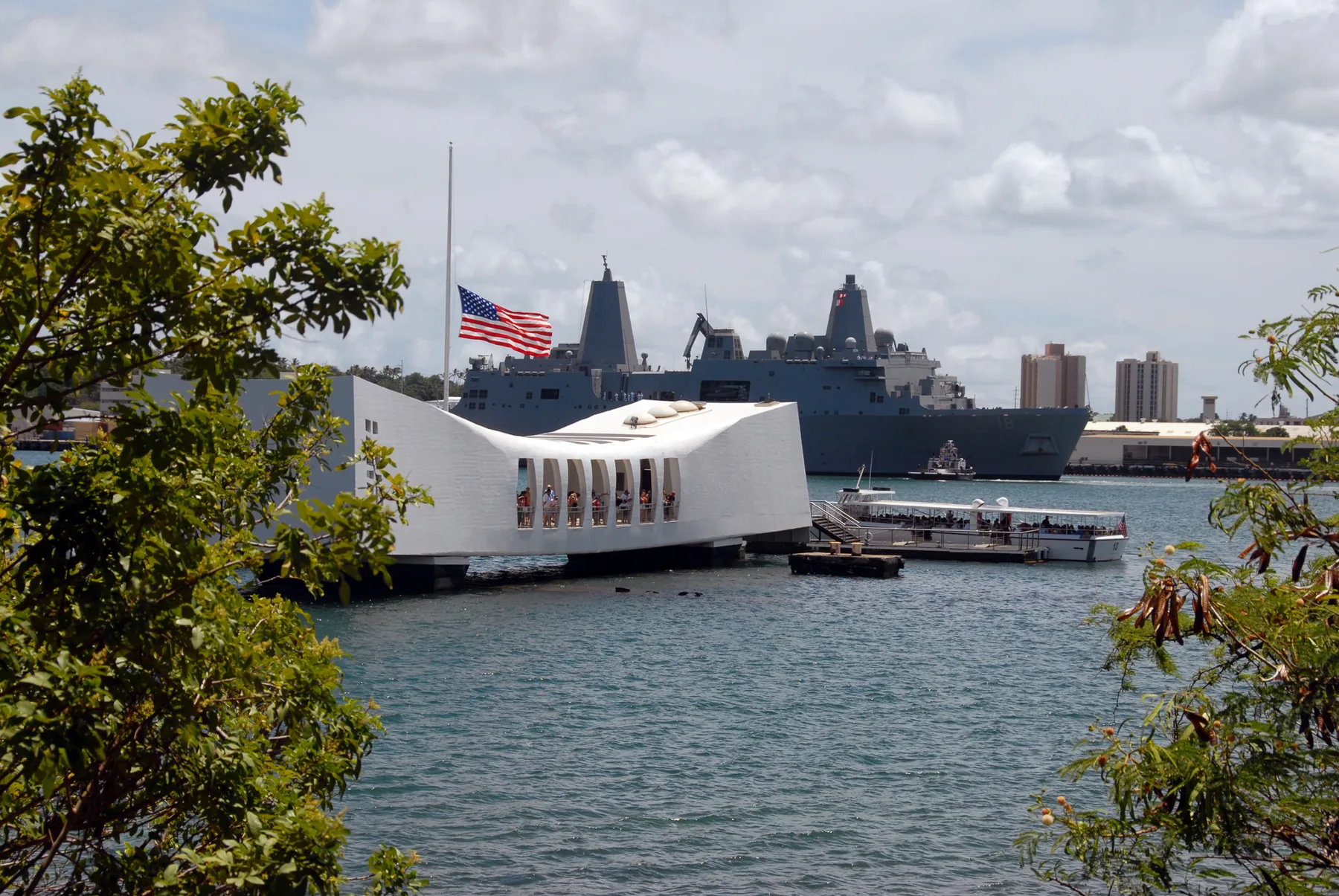 American flag at half-mast aboard the USS Arizona Memorial in Pearl Harbor