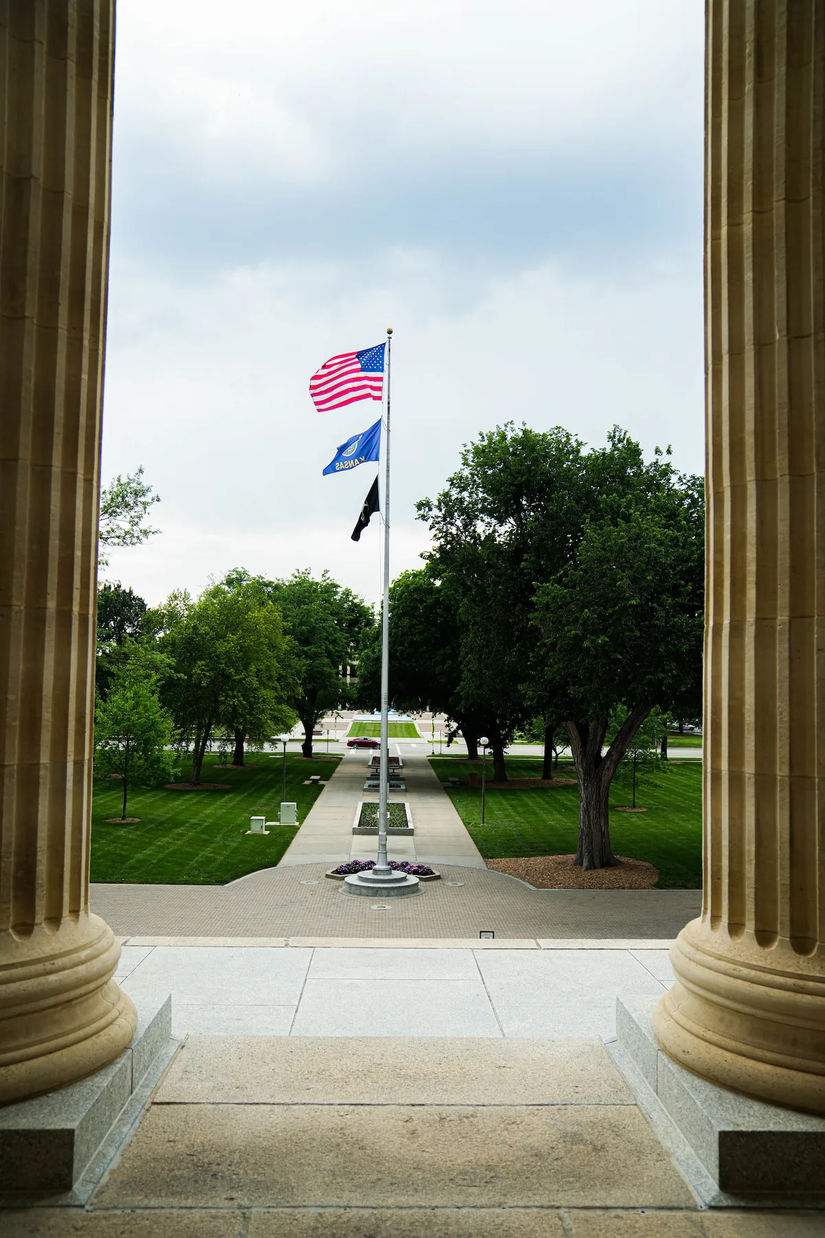 United States, Kansas and POW-MIA flags on the Kansas State Capitol grounds in Topeka