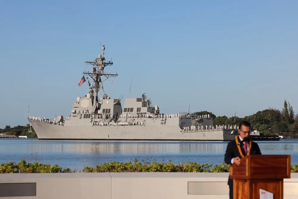 Sailors aboard USS Carl M. Levin rendering passing honors at Pearl Harbor National Memorial