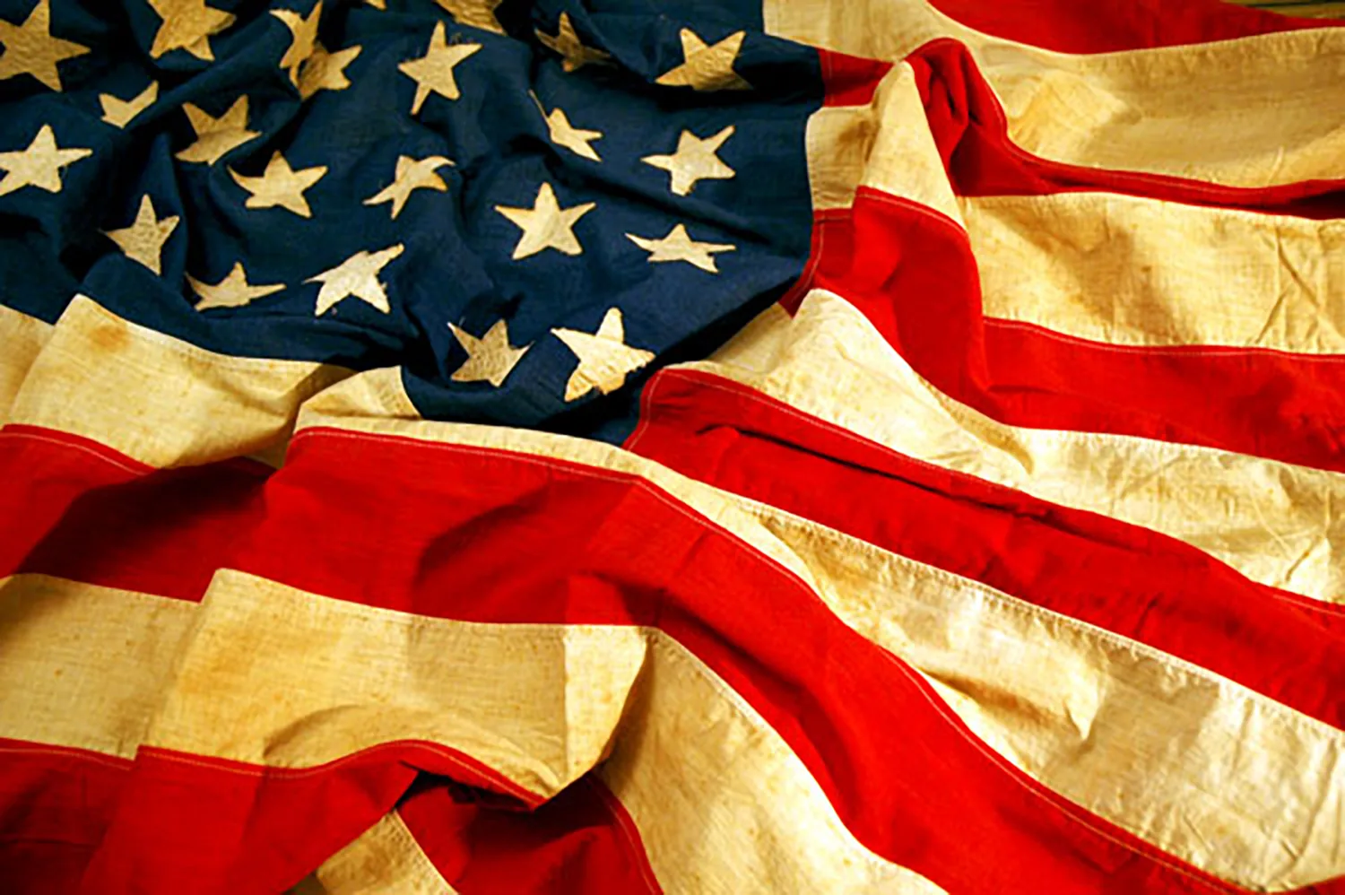 Worn American flag gathered for a dignified retirement ceremony