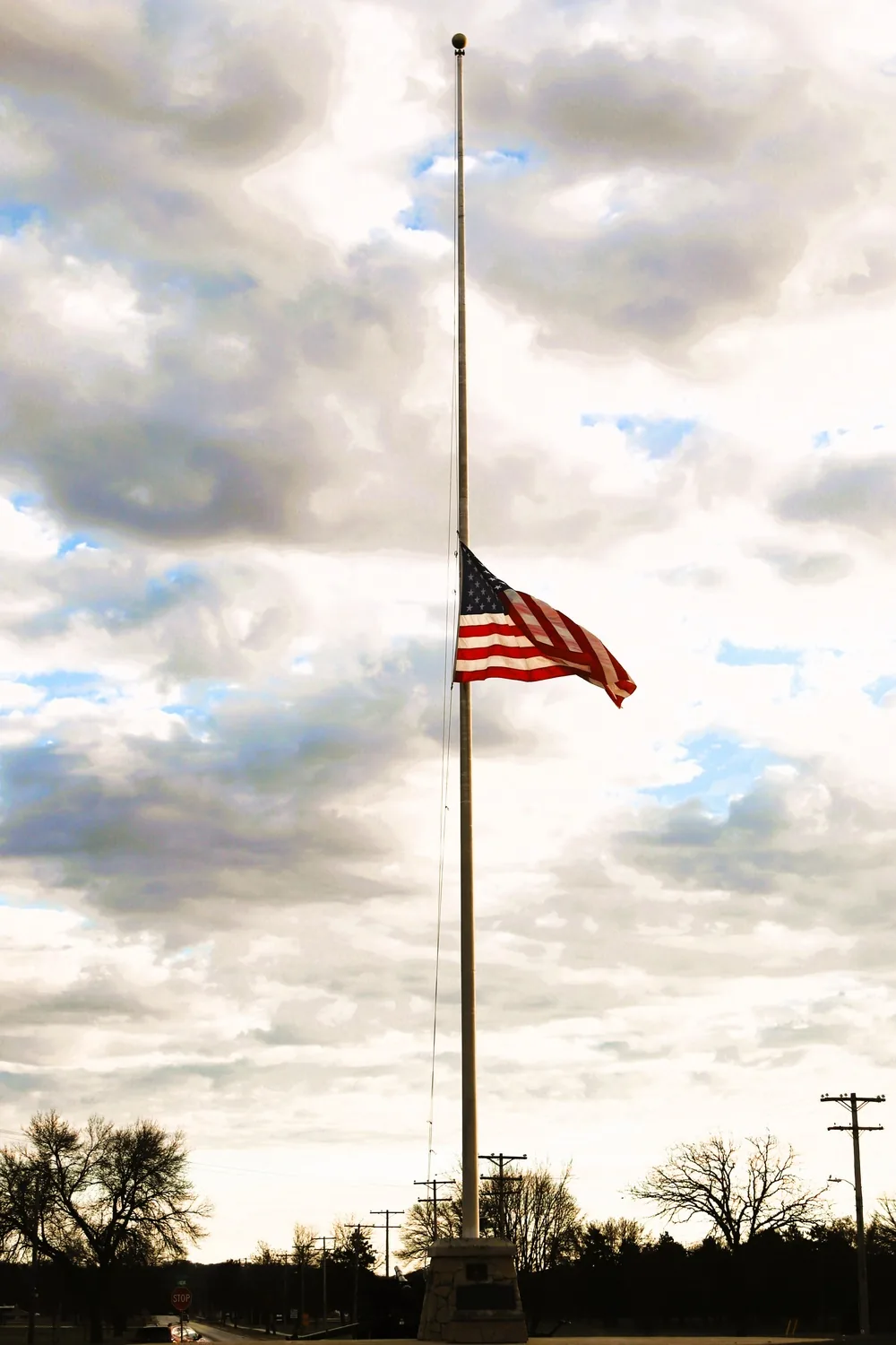 United States flag flying at half-staff at Fort McCoy in November 2025