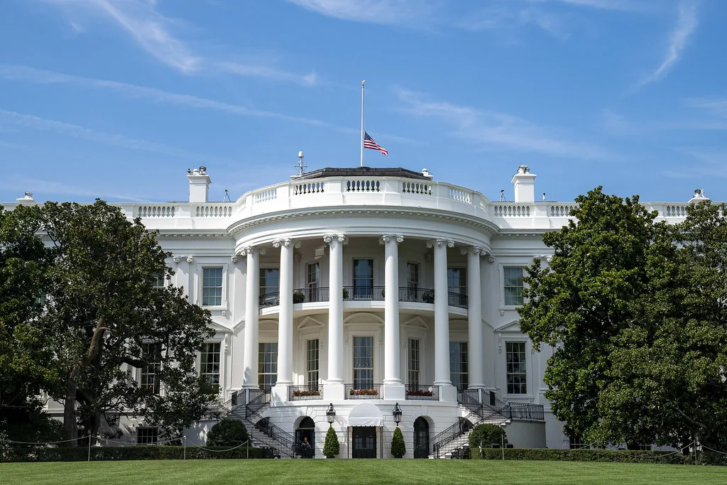 United States flag flying at half-staff above the White House